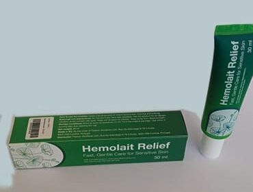 Упаковка и тюбик с Hemolait Relief на сером фоне.
